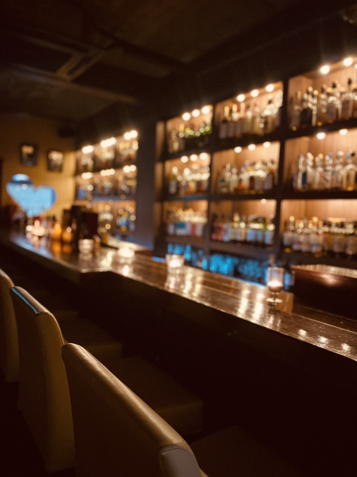 The counter and heart-shaped window at Bar Little Happiness